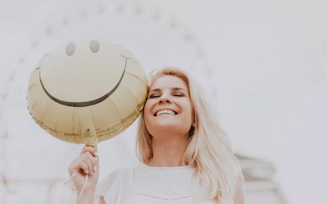 A woman smiling after discovering how to address trauma-related depression.