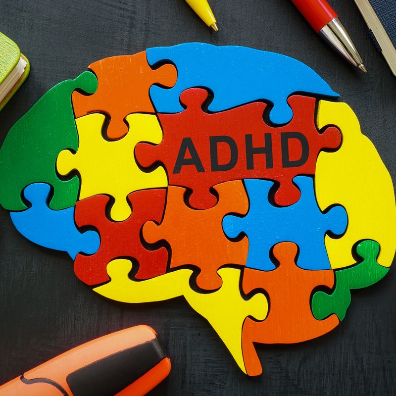 Brain made of colored pieces with the inscription ADHD.